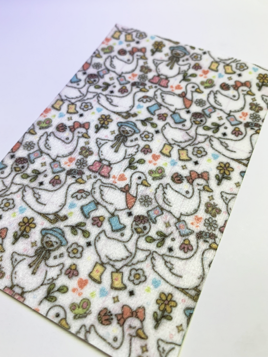 4x6" tubie tape featuring a white background with whimsical geese wearing boots, bows, and hats in a repeating pattern. Includes flowers, hearts, and small nature accents in soft pastel colors. Cute, playful, and cottagecore-inspired design.
