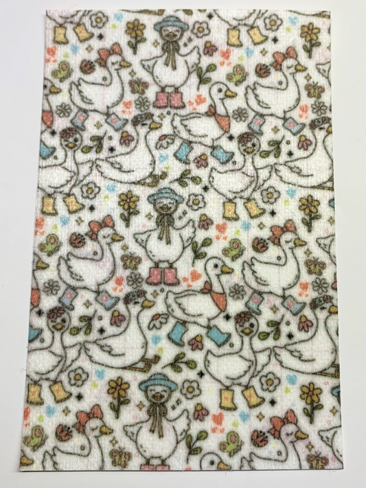 4x6" tubie tape featuring a white background with whimsical geese wearing boots, bows, and hats in a repeating pattern. Includes flowers, hearts, and small nature accents in soft pastel colors. Cute, playful, and cottagecore-inspired design.
